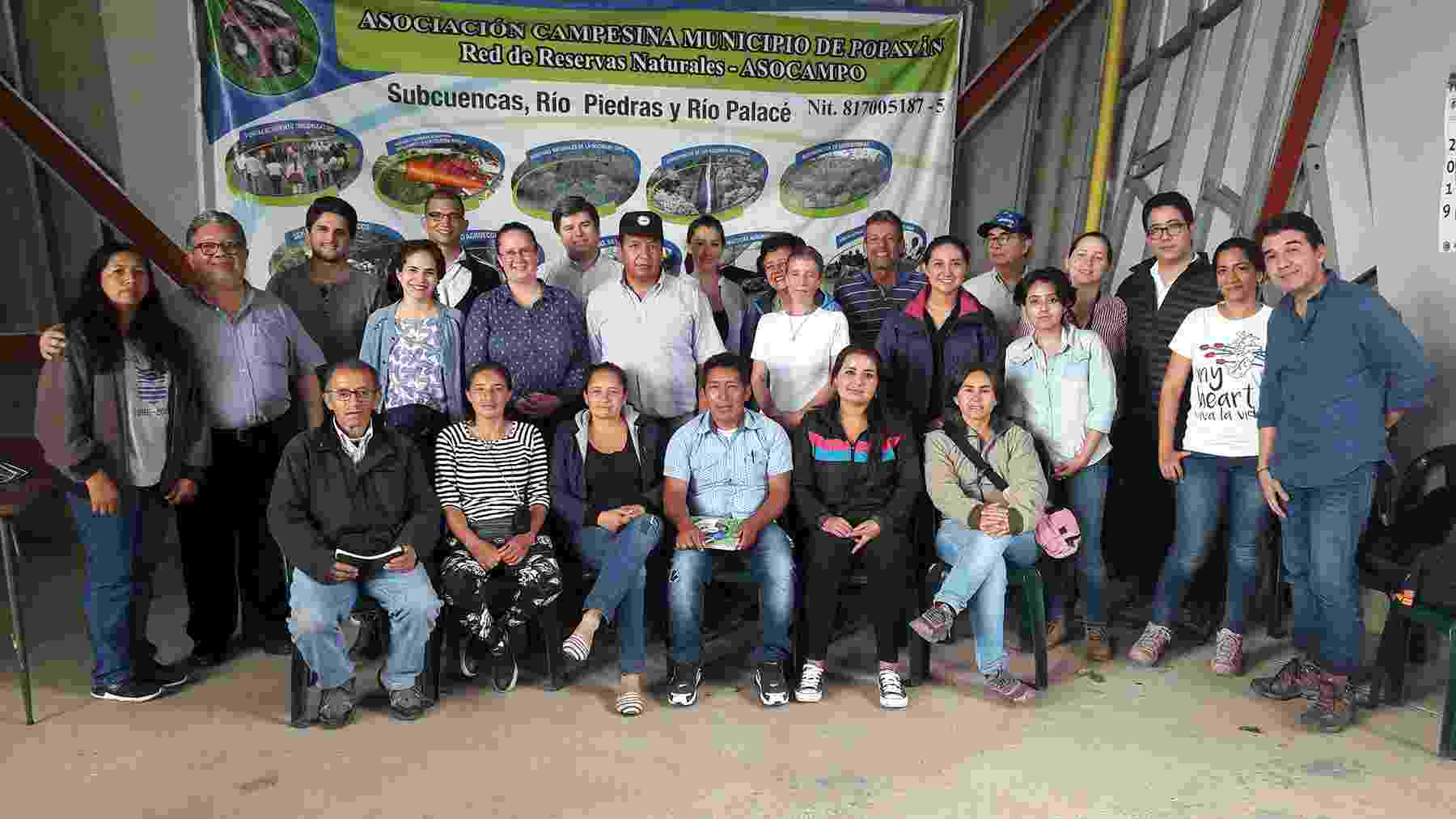 A group photograph of Hub colleagues with members of ASOCAMPO (Popayan Municipality Campesino Association Network of Natural Reserves) following a workshop in rural Colombia