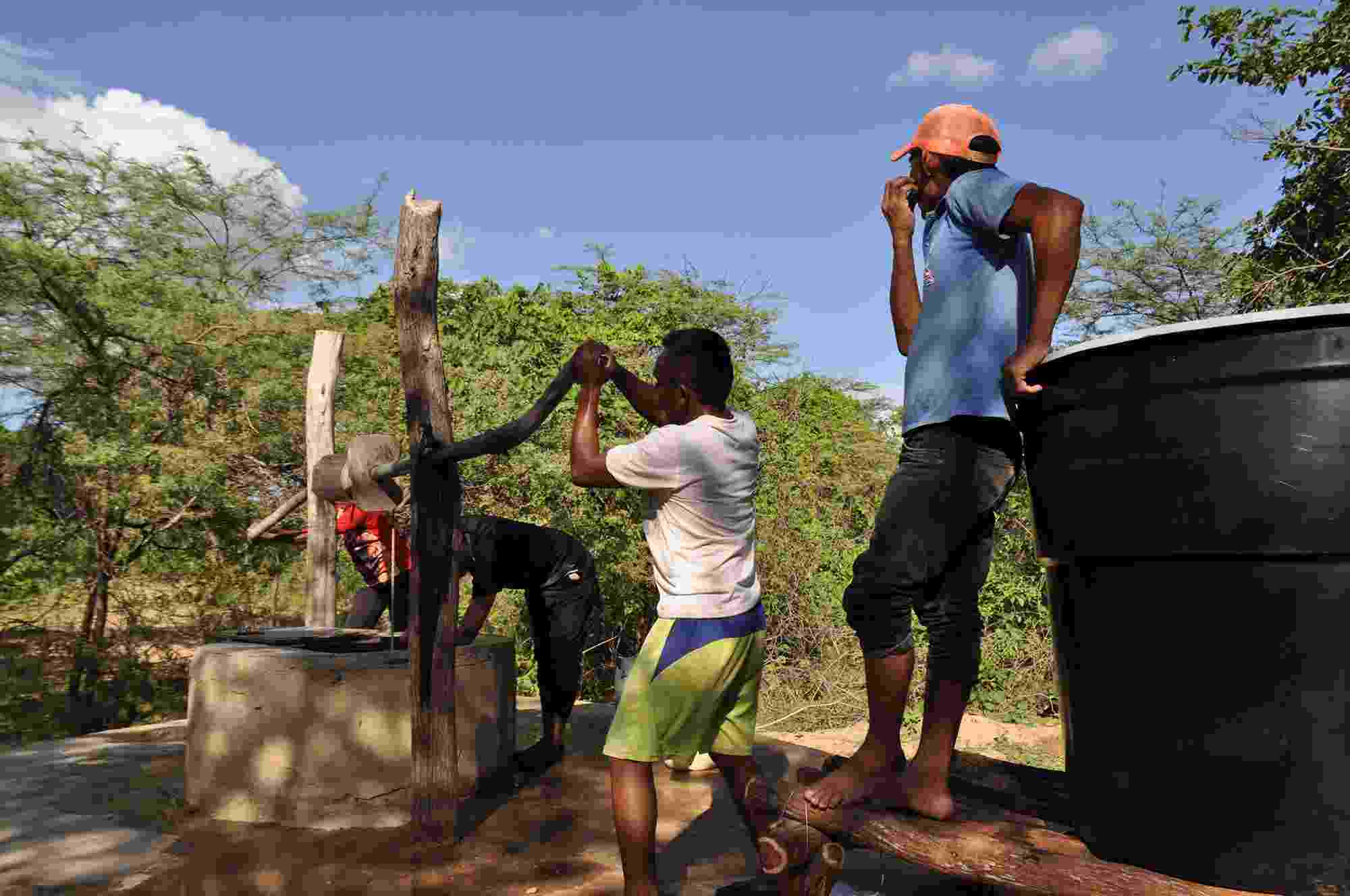 Wayuú community members using a water well to access clean drinking water, La Guajira, Colombia