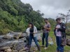 Hub and ASOCAMPO members can be seen taking water quality readings using a multiparameter probe on the bank of the Cauca River, with lush greenery behind thumbnail