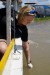 Michaela, from the NUMed team, leans out and collects a water sample over the edge of a boat thumbnail