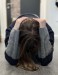 An actress kneels on the floor, cradling her head in her hands with her face turned downwards.  thumbnail