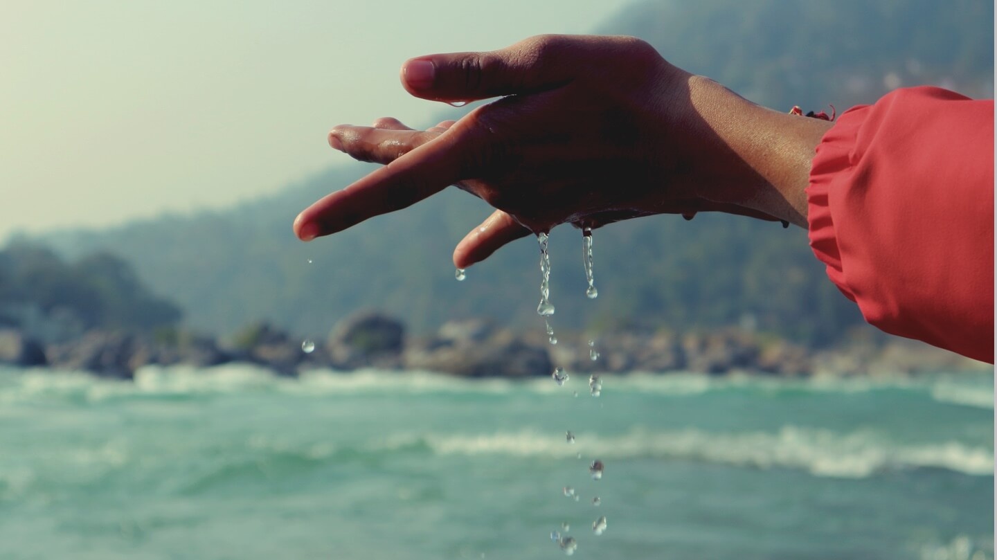 water drops falling from child's hand